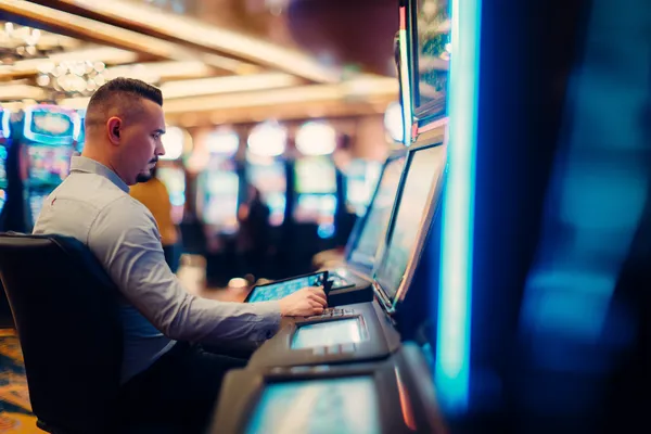 A young woman relaxing with her phone while dynamic casino elements float around her, illustrating the smooth mobile experience offered by the 778G0 app.